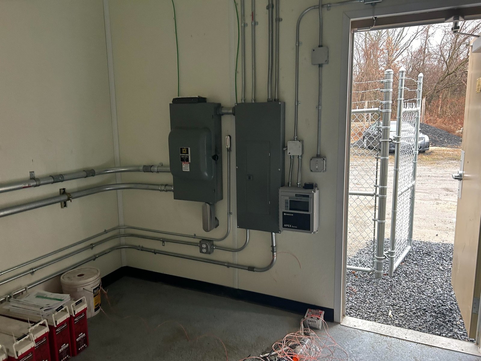 Clean commercial electrical panel and conduit installation by Geib's Electric