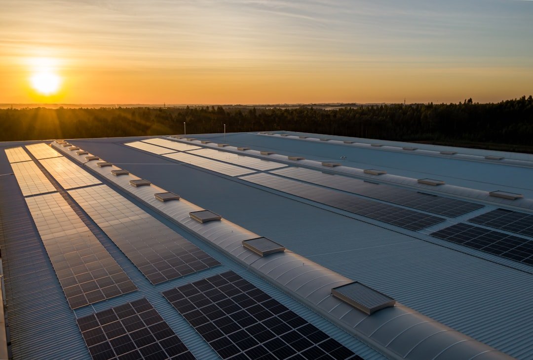 Commercial solar system on a flat roof at sunset