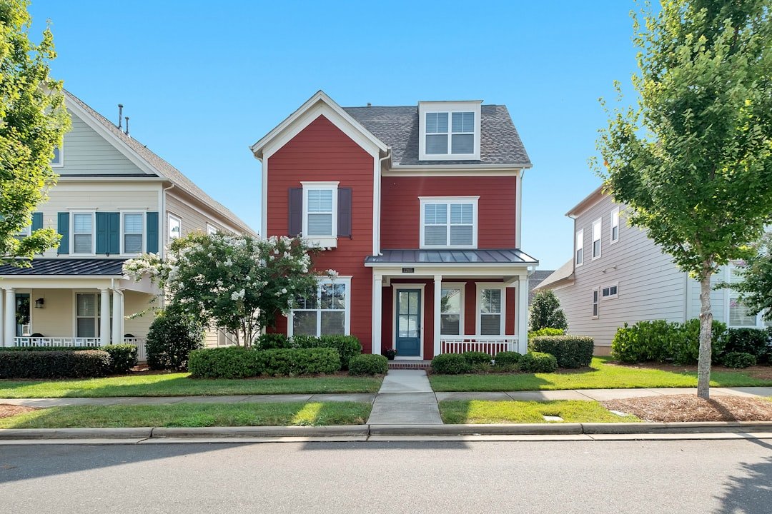Renovated red two-story home ready for resale